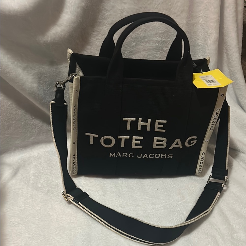 Marc Jacobs Black Messenger Bag with Adjustable Strap and Textured Fabric